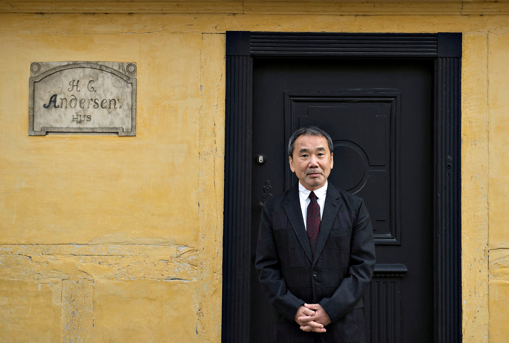Japanese writer Haruki Murakami, laureate of Hans Christian Andersen Literature Award 2016, is seen outside H. C. Andersen's house in Odense, Denmark October 30, 2016. Scanpix Denmark/Henning Bagger/via REUTERS/File Photo ATTENTION EDITORS - THIS IMAGE WAS PROVIDED BY A THIRD PARTY. DENMARK OUT. NO COMMERCIAL OR EDITORIAL SALES IN DENMARK. NO COMMERCIAL SALES.